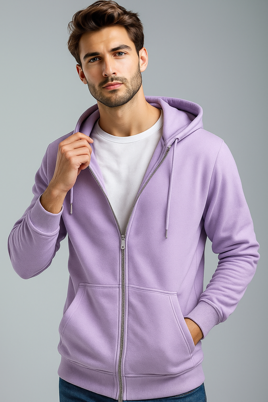 Man wearing a light purple hoodie on a gray background